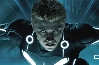 Garrett Hedlund in light-up suit stares intensely in Tron: Legacy scene