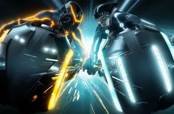 Two riders battle on glowing light cycles in Tron: Legacy
