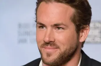 Ryan Reynolds close-up headshot with a slight smile
