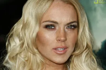 Lindsay Lohan close-up portrait with wavy blonde hair