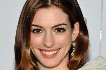 Headshot of Anne Hathaway smiling at camera