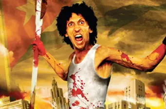 Man in blood-stained shirt holds flag yelling in city scene