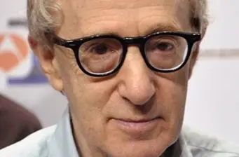 Close-up of Woody Allen wearing black glasses at event