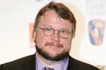 Guillermo del Toro headshot wearing glasses and beard at event
