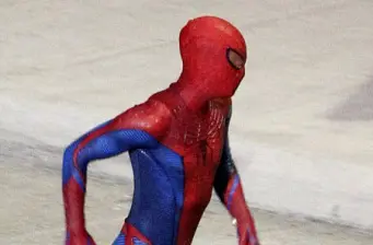 Spider-Man in classic suit running with side profile visible
