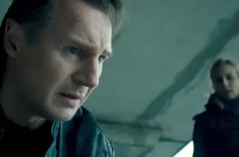 Close-up of a worried man in leather jacket, blurred person behind