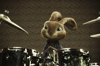 Animated rabbit playing drums in a movie scene