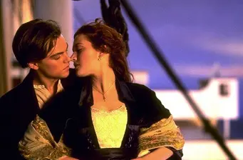 Jack and Rose lean close for a kiss on Titanic deck