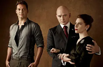 three actors in formal wear pose for theatrical promo photo