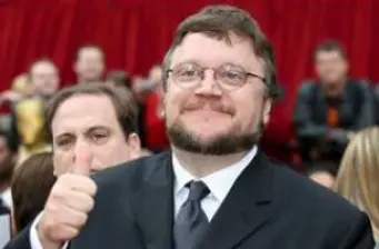 Filmmaker Guillermo del Toro giving thumbs up at event