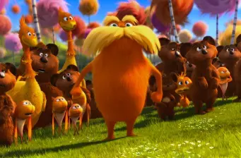 The Lorax with forest animals standing together on grass
