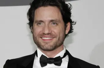 Venezuelan actor Edgar Ramirez smiling in tuxedo headshot