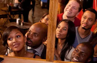 group of six people, men and women, engaged and looking around