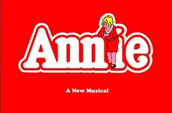 Logo of Broadway musical Annie with cartoon girl in red dress