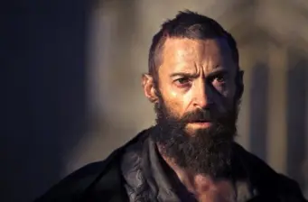bearded man in intense movie still with dark background