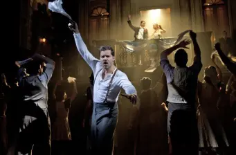 Ricky Martin performs energetically on stage with dancers at Tony Awards