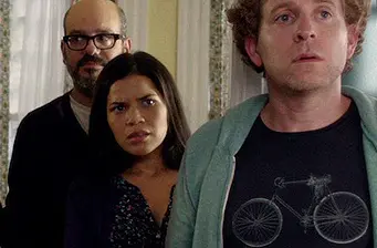 America Ferrera and two actors look tense in indoor scene
