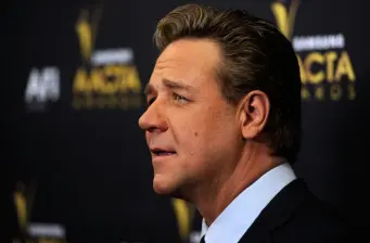 Russell Crowe side profile in suit at AACTA Awards event