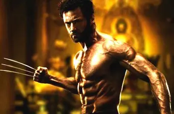 Hugh Jackman shirtless as Wolverine with claws extended