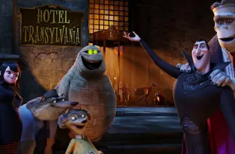 Hotel Transylvania animated characters grouped near hotel sign