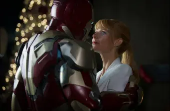 Iron Man holds Pepper Potts in a tender moment