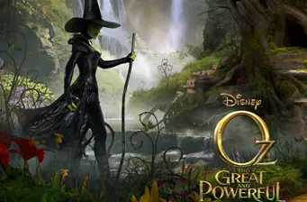 Witch with staff stands in forest in Oz the Great and Powerful movie poster