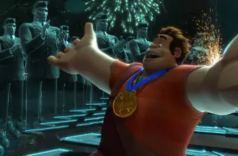 Wreck-It Ralph animated character wearing gold medal with fireworks behind