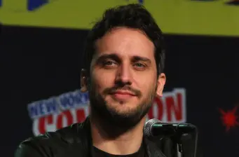 Fede Alvarez speaking into microphone at a panel event