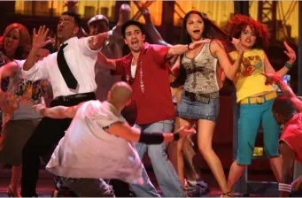 original In the Heights cast performing an energetic dance on stage
