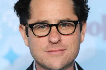Headshot of director J.J. Abrams wearing glasses and slight smile