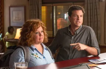 woman and man talking at bar counter in movie scene
