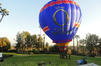 Hot air balloon with Oz the Great and Powerful logo in park