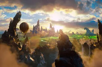 rocky fantasy landscape with hot air balloon floating at sunset