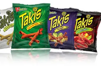Four colorful Takis snack chip bags in different flavors lined up