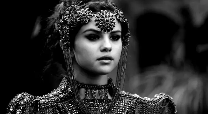 Selena Gomez close-up in ornate costume from Slow Down music video
