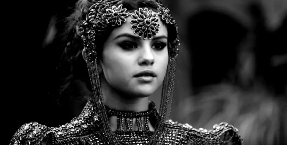 Selena Gomez in an elaborate headpiece and costume in her ‘Slow Down’ 2013 music video.
Selena Gomez close-up in ornate costume from Slow Down music video