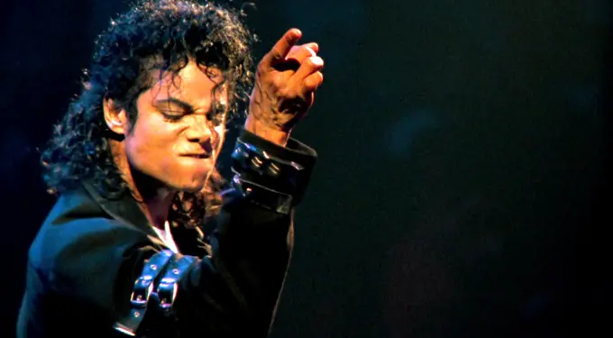 Michael Jackson performing with clenched fist and intense expression