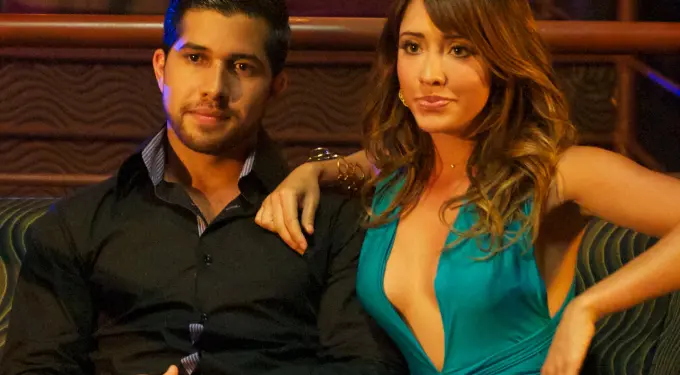 Walter Perez and Fernanda Romero sit together in a lounge scene