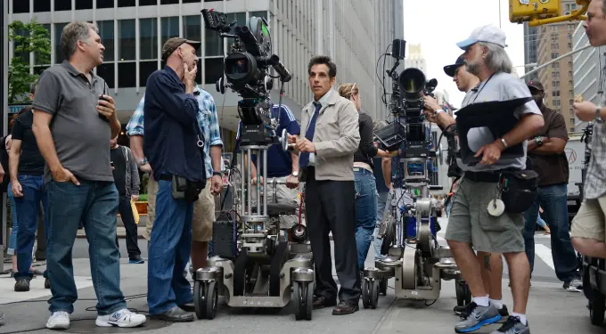 Ben Stiller directing film crew with cameras on city street