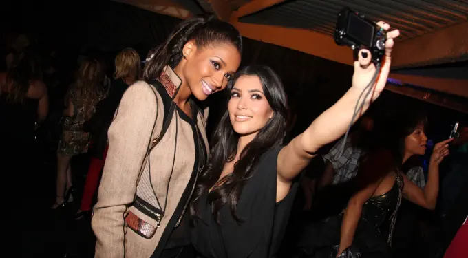 Ciara and Kim Kardashian smile while taking a selfie at event