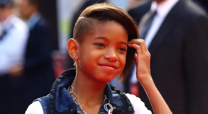 Willow Smith with side-shaved haircut smiles at event
