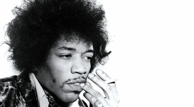 Black and white close-up of Jimi Hendrix smoking a cigarette