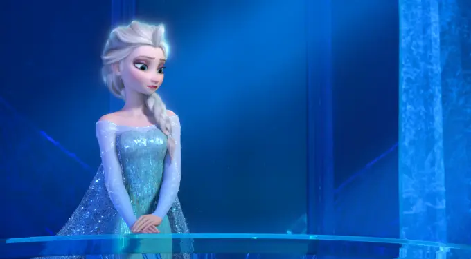 Elsa in blue dress looking down inside her ice palace