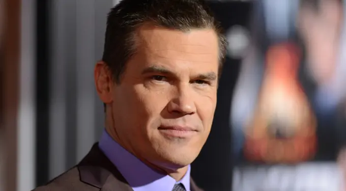 Close-up headshot of actor Josh Brolin in suit and tie