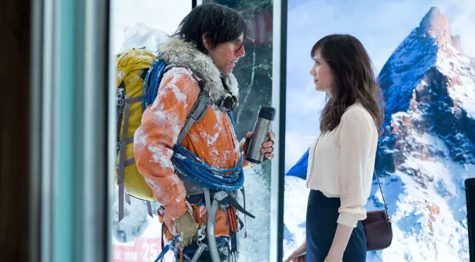 man in climbing gear talks to woman by snowy mountain poster