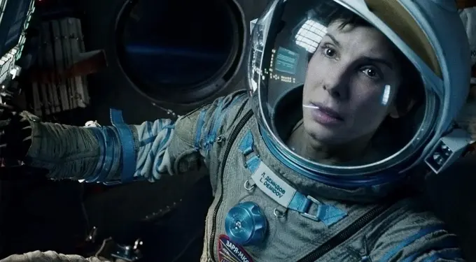 Sandra Bullock in space suit inside spacecraft from Gravity