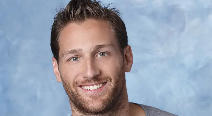 Headshot of Juan Pablo Galavis smiling against blue backdrop