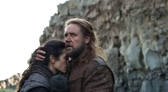 ‘Noah’ movie scene showing emotional embrace outdoors
Man with beard embraces woman near rocky cliff, both in rough clothes