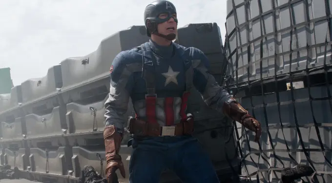 Chris Evans as Captain America in action on military ship, fallen soldiers behind