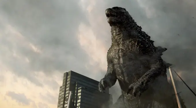 Godzilla towering over skyscrapers with smoky city backdrop